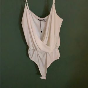 Cross layered body suit.